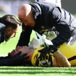 Chelsea goalkeeper Emiliano Martinez stretchered off after head clash with Everton defender