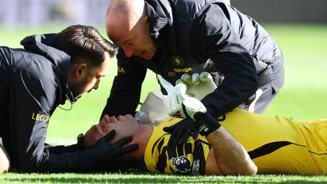 Chelsea goalkeeper Emiliano Martinez stretchered off after head clash with Everton defender