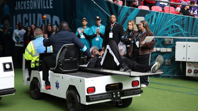 NFL umpire Larry Smith injured after slipping on slick Wembley field during Jaguars-Texans game